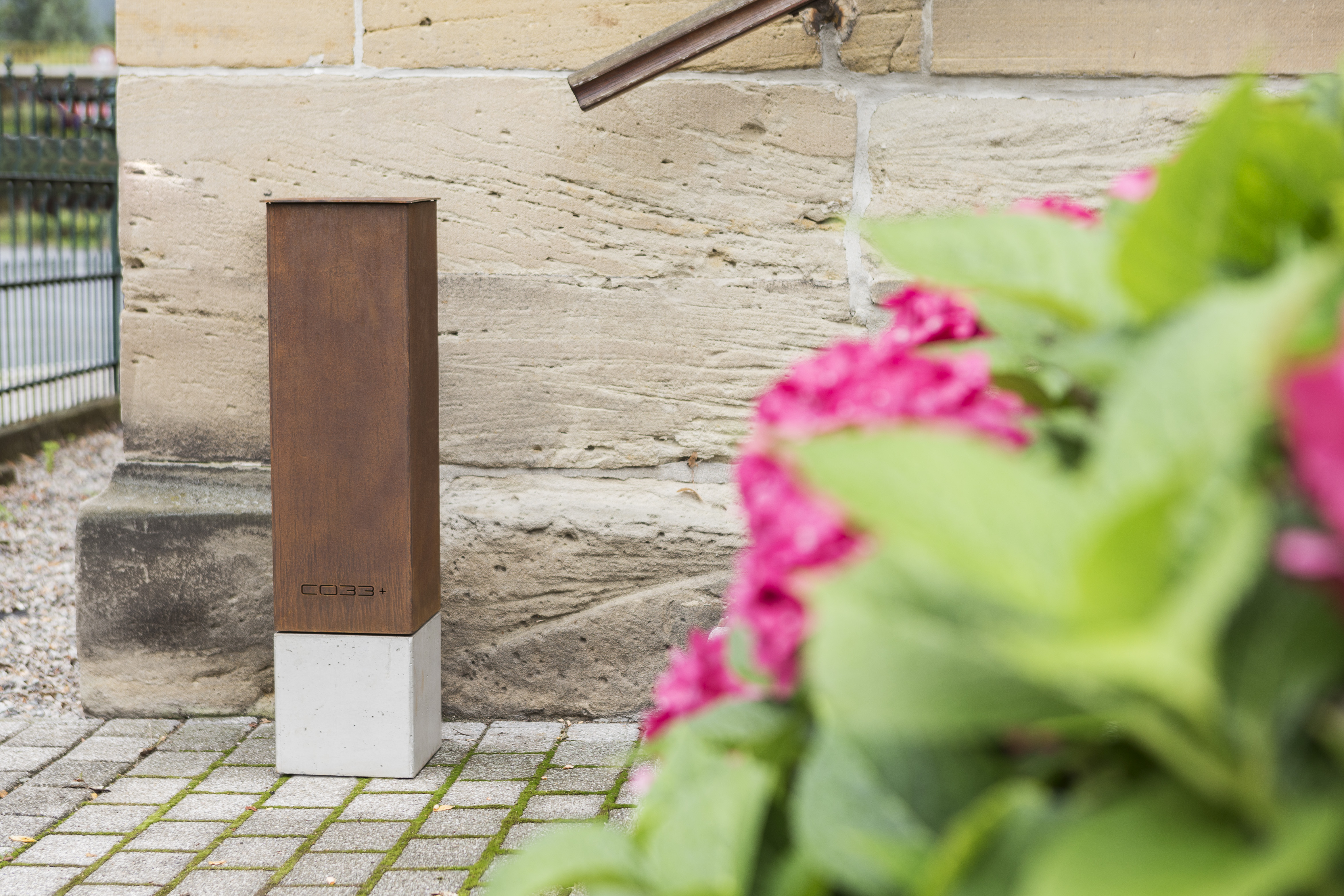 Designer Standing Ashtray with Corten Steel Column and Concrete Base for the smoking area